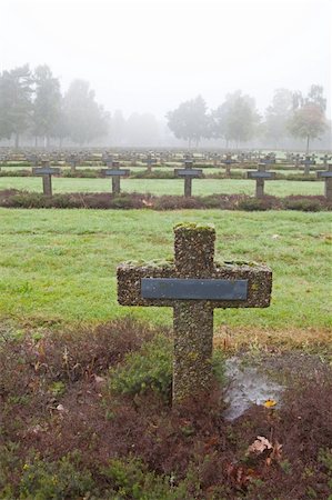 simsearch:400-04032243,k - crosses at cemetery in autumn mist stone tombstones Stock Photo - Budget Royalty-Free & Subscription, Code: 400-04749439