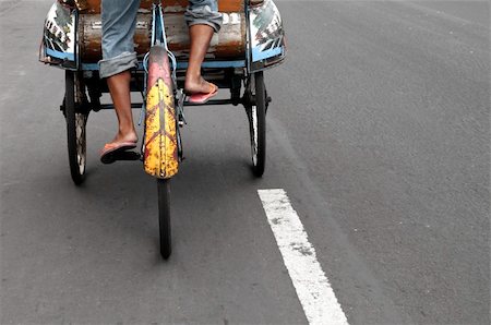 Taxi driver  in a  traditional indonesian taxi transport, becak Stock Photo - Budget Royalty-Free & Subscription, Code: 400-04740123