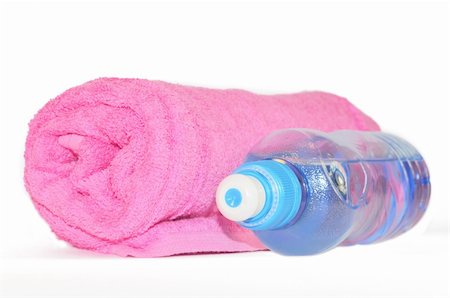 Twisted pink towel and bottle of sparkling water isolated on white background Stock Photo - Budget Royalty-Free & Subscription, Code: 400-04740239
