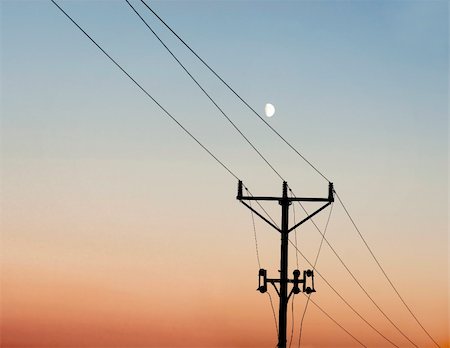 electrical energy hazard - Silhouette of electricity pole against evening sky Stock Photo - Budget Royalty-Free & Subscription, Code: 400-04740706