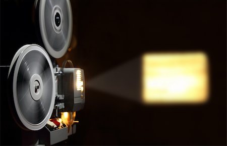 projector - old projector showing the film in dusk Stock Photo - Budget Royalty-Free & Subscription, Code: 400-04754642