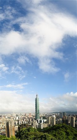 simsearch:400-07111236,k - Cityscape of Taipei with famous landmark, 101 skyscraper, under white clouds and blue sky. Vertical panoramic city scenery. Stock Photo - Budget Royalty-Free & Subscription, Code: 400-04754794