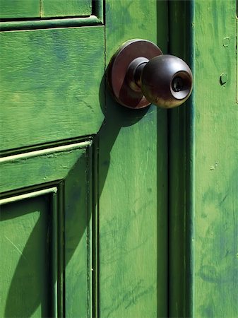 Old iron doorknob on Green wood door Stock Photo - Budget Royalty-Free & Subscription, Code: 400-04755794