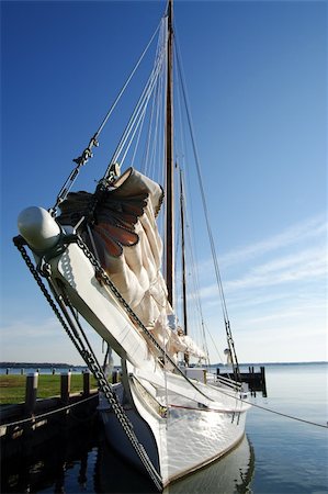 simsearch:400-04433053,k - Skipjack sailboats were designed in the late 1800’s for oyster dredging in the Chesapeake Bay. In 2010 about 40 skipjacks remain in existence, some of which are still actively used for fishing. Stock Photo - Budget Royalty-Free & Subscription, Code: 400-04756211