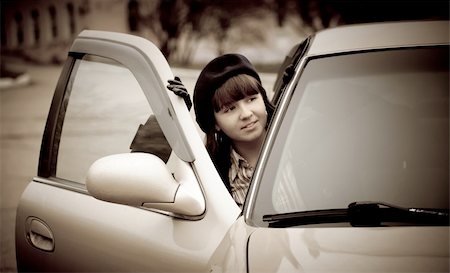 Young woman in a retro car, vintage style Stock Photo - Budget Royalty-Free & Subscription, Code: 400-04756838
