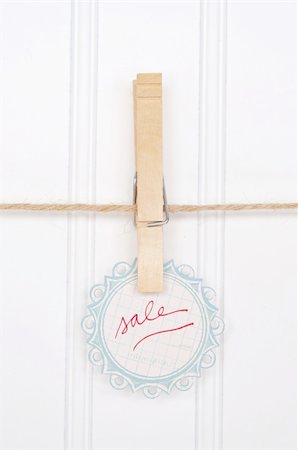 simsearch:400-04263617,k - Holiday Sale Concept with Sale Tag Hanging on a Clothesline. Photographie de stock - Aubaine LD & Abonnement, Code: 400-04757465