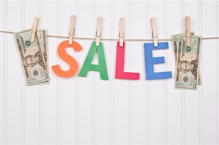 simsearch:400-04263617,k - Vibrant Image for Your Next SALE featuring the word SALE and American Currency. Photographie de stock - Aubaine LD & Abonnement, Code: 400-04758695