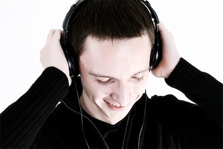 simsearch:400-05748462,k - young man in headphones and relaxing under the sounds of music Stock Photo - Budget Royalty-Free & Subscription, Code: 400-04759625