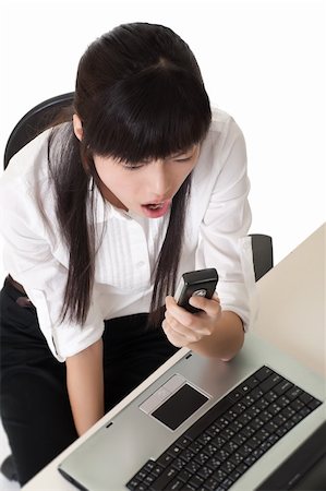 Business woman yell at cellphone in office. Stock Photo - Budget Royalty-Free & Subscription, Code: 400-04750960