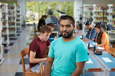 students reading in groups - portrait of male college student sitting on table in library and looking at camera. Horizontal shape, waist up Stock Photo - Budget Royalty-Free & Subscription, Code: 400-04751234