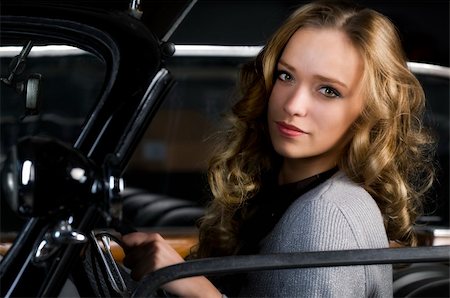 simsearch:400-04754019,k - pretty young woman in an old car Stock Photo - Budget Royalty-Free & Subscription, Code: 400-04751726