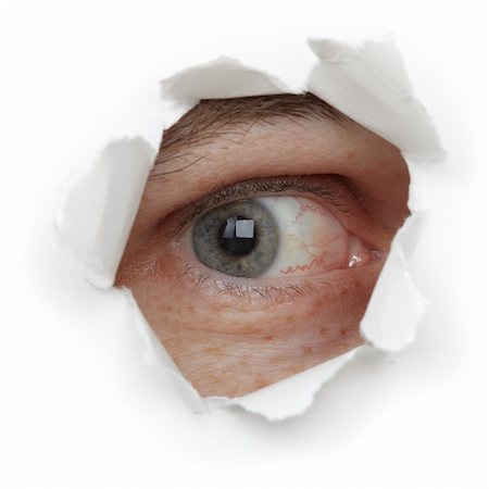 simsearch:400-04748544,k - Eye of the person in a hole close up isolated on white background Stock Photo - Budget Royalty-Free & Subscription, Code: 400-04764442