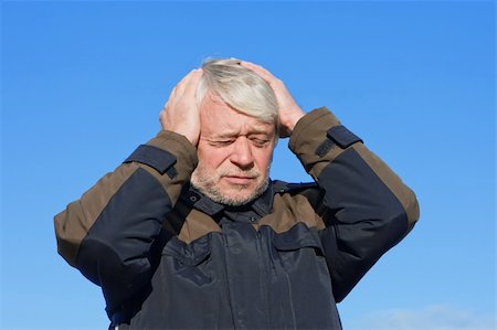 Portrait of mature concerned man with grey hair on blue sky of the background. Stock Photo - Budget Royalty-Free & Subscription, Code: 400-04765144