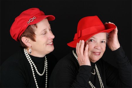 simsearch:400-04283915,k - Adult mother and daughter wearing red hats Stock Photo - Budget Royalty-Free & Subscription, Code: 400-04765258