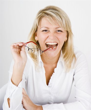a pretty young woman laughs, holding glasses Stock Photo - Budget Royalty-Free & Subscription, Code: 400-04774584