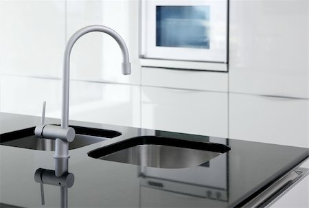 kitchen faucet and oven modern black and white interior design Photographie de stock - Aubaine LD & Abonnement, Code: 400-04774925