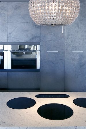 slate stone kitchen forniture marble bench integrated vitroceramic stove Photographie de stock - Aubaine LD & Abonnement, Code: 400-04774928