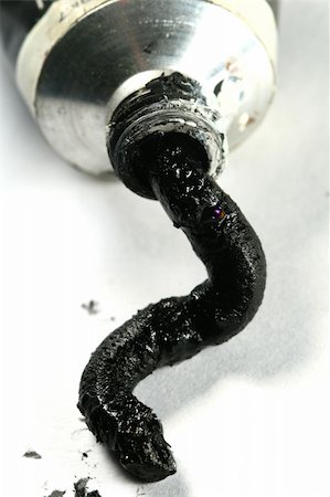 black paint in tube on white paper Stock Photo - Budget Royalty-Free & Subscription, Code: 400-04778555