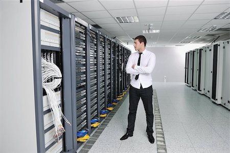 simsearch:400-05291415,k - young handsome business man  engeneer in datacenter server room Stock Photo - Budget Royalty-Free & Subscription, Code: 400-04779204