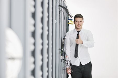 simsearch:400-04239432,k - young handsome business man  engeneer in datacenter server room Stock Photo - Budget Royalty-Free & Subscription, Code: 400-04779209