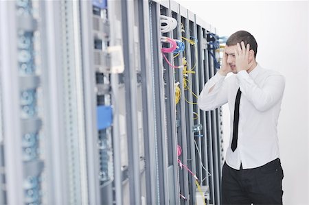 simsearch:400-05881495,k - young handsome business man  engeneer in datacenter server room Stock Photo - Budget Royalty-Free & Subscription, Code: 400-04779214