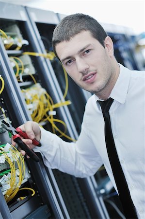 simsearch:400-04239432,k - young handsome business man  engeneer in datacenter server room Stock Photo - Budget Royalty-Free & Subscription, Code: 400-04779215