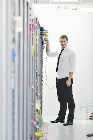 simsearch:400-05881495,k - young handsome business man  engeneer in datacenter server room Stock Photo - Budget Royalty-Free & Subscription, Code: 400-04779216