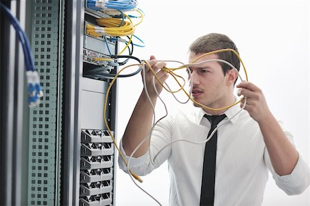 simsearch:400-05881495,k - young handsome business man  engeneer in datacenter server room Stock Photo - Budget Royalty-Free & Subscription, Code: 400-04779217