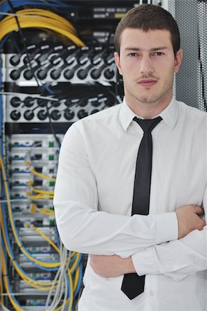 simsearch:400-05881495,k - young handsome business man  engeneer in datacenter server room Stock Photo - Budget Royalty-Free & Subscription, Code: 400-04779211