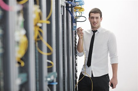 simsearch:400-05291415,k - young handsome business man  engeneer in datacenter server room Stock Photo - Budget Royalty-Free & Subscription, Code: 400-04779229