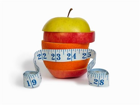 simsearch:400-05367726,k - Slices of apples and orange as one fruit and a measuring tape. Isolated with clipping path. Stock Photo - Budget Royalty-Free & Subscription, Code: 400-04771269