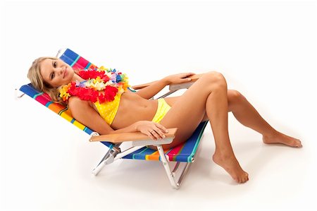 Young woman with yellow bikini and red lei lying in beach chair Stock Photo - Budget Royalty-Free & Subscription, Code: 400-04771982