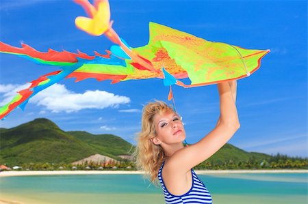 simsearch:400-05328142,k - Young woman with kite on the beach Stock Photo - Budget Royalty-Free & Subscription, Code: 400-04784315