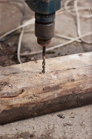 drilling (activity) - Drill drilling  wooden board Foto de stock - Super Valor sin royalties y Suscripción, Código: 400-04785052