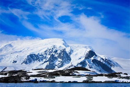 Beautiful snow-capped mountains against the blue sky Stock Photo - Budget Royalty-Free & Subscription, Code: 400-04786229
