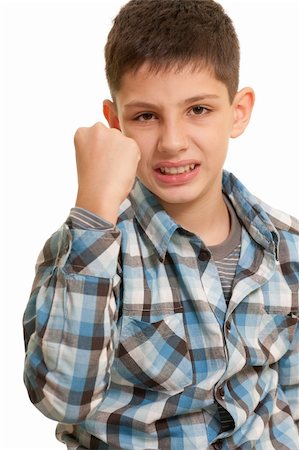 simsearch:400-06363059,k - An angry boy is demonstrating his fist; isolated on the white background Stock Photo - Budget Royalty-Free & Subscription, Code: 400-04786686