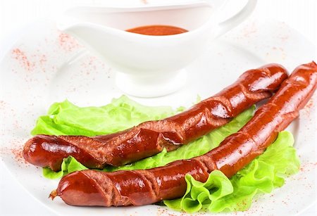 simsearch:400-04587885,k - grilled sausage closeup with lettuce and red sauce Stock Photo - Budget Royalty-Free & Subscription, Code: 400-04788388