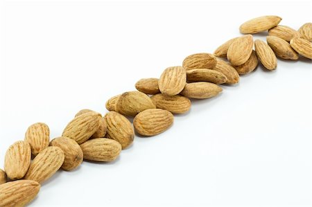 simsearch:400-04833195,k - Almonds isolated on white Stock Photo - Budget Royalty-Free & Subscription, Code: 400-04788710