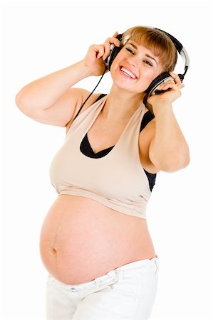 simsearch:400-04817039,k - Happy pregnant woman listening music in headphones  isolated on white Stock Photo - Budget Royalty-Free & Subscription, Code: 400-04789403