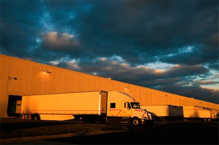 semi truck car carriers - Dramatic sunset above distribution warehouse. Semi Truck ready to leave. Stock Photo - Budget Royalty-Free & Subscription, Code: 400-04781348