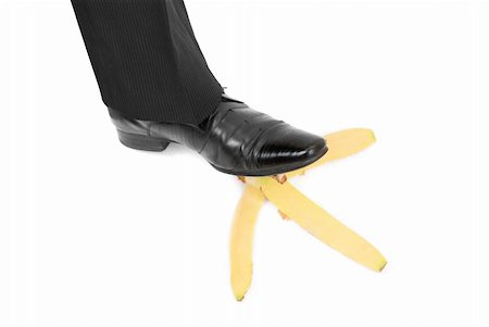 slapstick - Business boot to step on a banana skin on a white Stock Photo - Budget Royalty-Free & Subscription, Code: 400-04781660