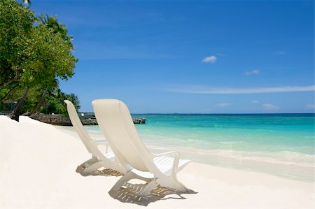simsearch:400-03991814,k - Two empty beach chairs. Coast of Indian ocean. Maldives Stock Photo - Budget Royalty-Free & Subscription, Code: 400-04782630