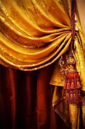 red and gold fabric for curtains - curtain with an ornament in the modern  apartment Stock Photo - Budget Royalty-Free & Subscription, Code: 400-04794041