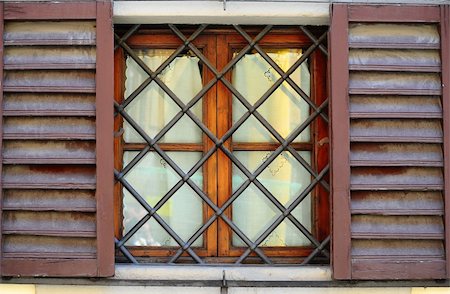 simsearch:400-04393153,k - Typical Italian Window With Open Wooden Shutters, Decorated With Grille Foto de stock - Super Valor sin royalties y Suscripción, Código: 400-04796566
