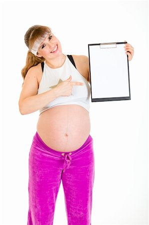 simsearch:400-04798379,k - Smiling beautiful pregnant woman pointing on blank clipboard isolated on white Stock Photo - Budget Royalty-Free & Subscription, Code: 400-04798378