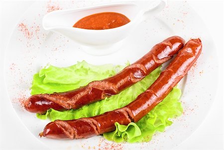 simsearch:400-04587885,k - grilled sausages closeup with lettuce and sauce isolated on white Stock Photo - Budget Royalty-Free & Subscription, Code: 400-04799150