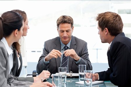 simsearch:400-05746962,k - Serious manager at a table with his team during a meeting at the office Stock Photo - Budget Royalty-Free & Subscription, Code: 400-04791808