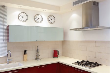 Luxury kitchen with red and marble elements Foto de stock - Super Valor sin royalties y Suscripción, Código: 400-04807789