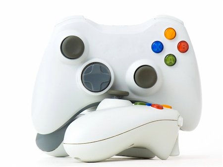 Two console's white gamepads isolated on white background Stock Photo - Budget Royalty-Free & Subscription, Code: 400-04807844
