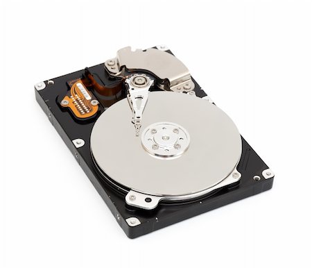 simsearch:400-05252692,k - Opened computer harddisk isolated on white background Stock Photo - Budget Royalty-Free & Subscription, Code: 400-04807923